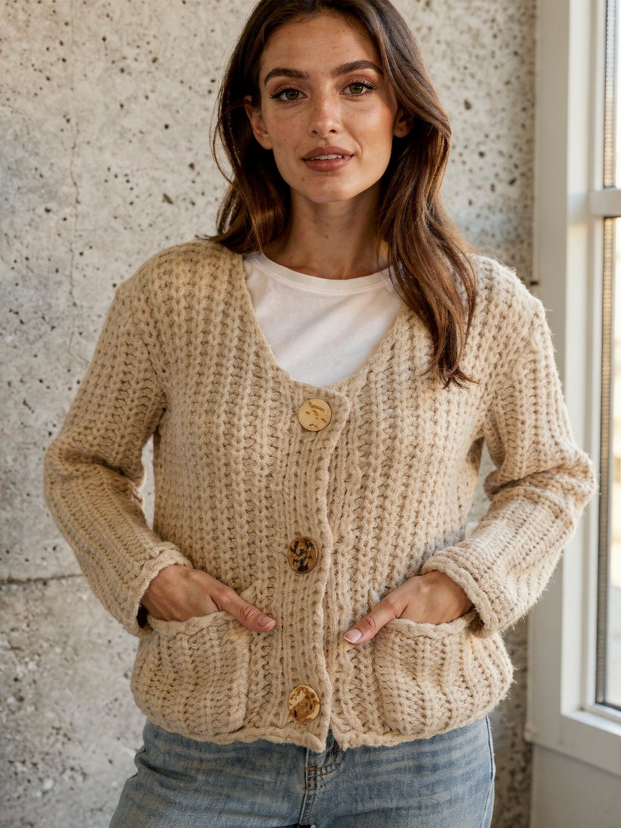 Deep front pockets on the cream chunky knit cardigan